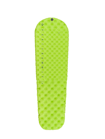 The bright green, inflatable Sea to Summit Comfort Light Air Sprung Mat features a quilted pattern and Air Sprung Cells. It includes a multi-function high flow-rate valve and is labeled "Sea to Summit" along the side.