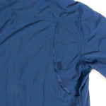 The back of a Mont Men's Lifestyle Vented Shirt lies on a white surface, giving off hints of UV resistance.