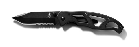 The Gerber Paraframe Mini Tanto Folding Knife, a product by Gerber, features a black titanium nitride-coated partially serrated blade and an ergonomic metal handle with cut-out designs. The black folding knife is unfolded and positioned against a white background.