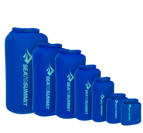 A Sea to Summit lightweight dry bag in blue with a DWR finish.