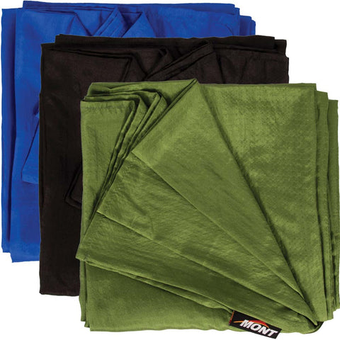 Three folded fabric pieces in blue, black, and green are stacked, with the green fabric on top displaying a "Mont" label. Perfect for travel and bushwalking, this Mont 100% Silk Liner doubles as an ultralight sleeping bag liner.